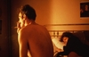  
Nan et Brian au lit, New York, 1983.
Courtesy of Les Rencontres d’Arles
